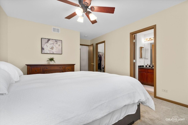 239 Nicole Dr Unit A, South Elgin, IL 60177 - bedroom with light carpet, a spacious closet, ensuite bathroom, baseboards, and a ceiling fan