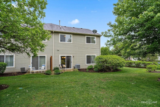 239 Nicole Dr Unit A, South Elgin, IL 60177 - rear view of house with a lawn and central air condition unit