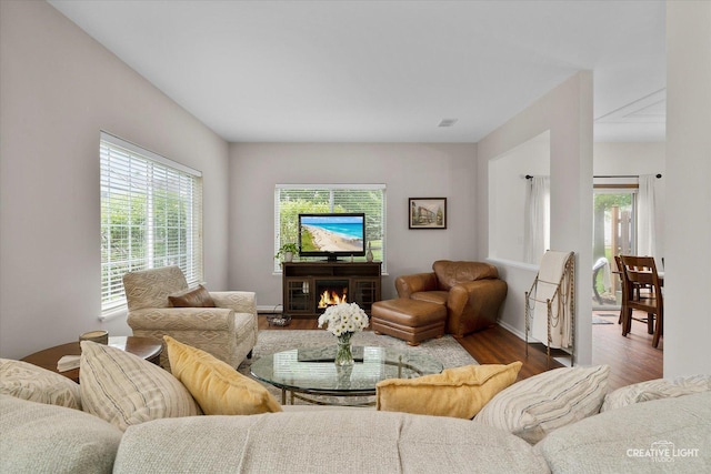 239 Nicole Dr Unit A, South Elgin, IL 60177 - living area with wood finished floors, healthy amount of natural light, and a lit fireplace