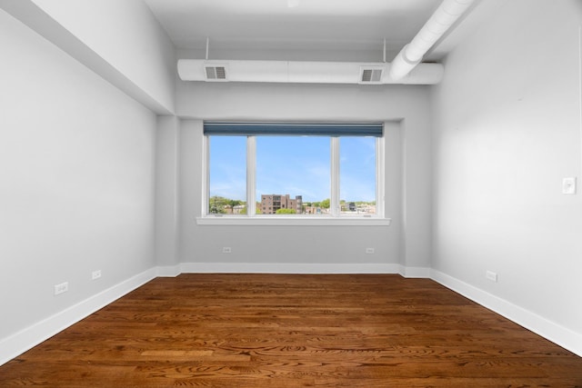4751 N Artesian Ave Unit 401, Chicago, IL 60625 - unfurnished room with baseboards and wood finished floors