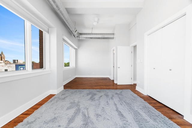 4751 N Artesian Ave Unit 401, Chicago, IL 60625 - empty room featuring dark wood finished floors and baseboards