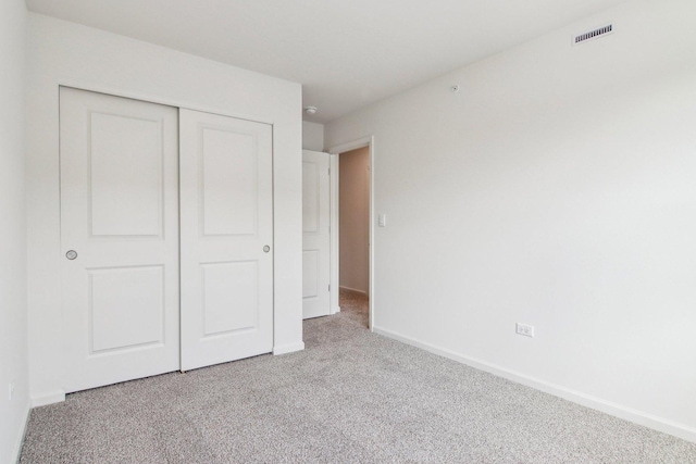6335 Ulster Dr, Tinley Park, IL 60477 - unfurnished bedroom featuring carpet, a closet, and baseboards