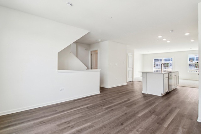 6335 Ulster Dr, Tinley Park, IL 60477 - unfurnished living room featuring dark wood finished floors, recessed lighting, baseboards, and a sink