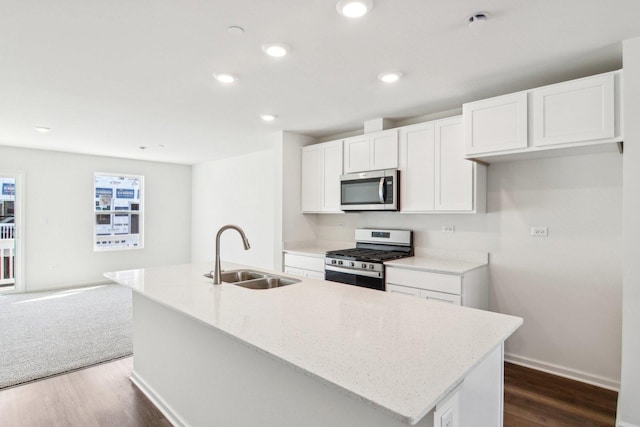 6335 Ulster Dr, Tinley Park, IL 60477 - kitchen featuring appliances with stainless steel finishes, a sink, a center island with sink, dark wood-style floors, and white cabinetry