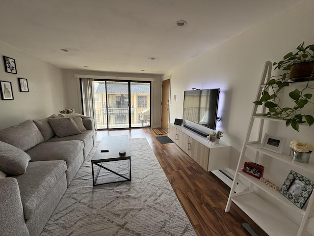 living room featuring dark wood-style flooring
