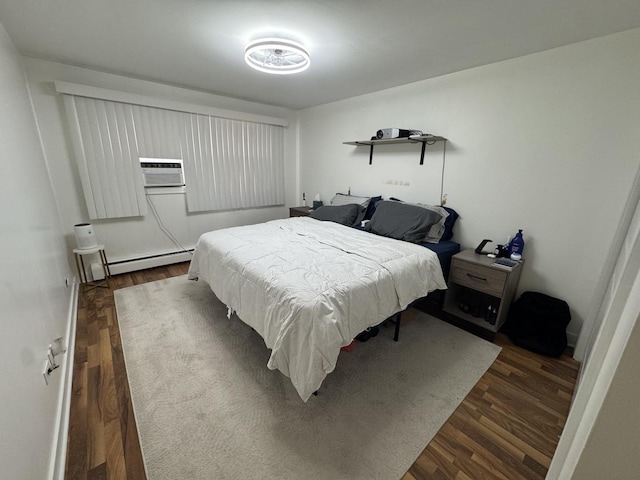 bedroom featuring a baseboard radiator and dark wood-style flooring