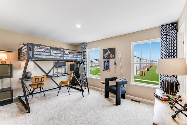 bedroom with carpet and baseboards