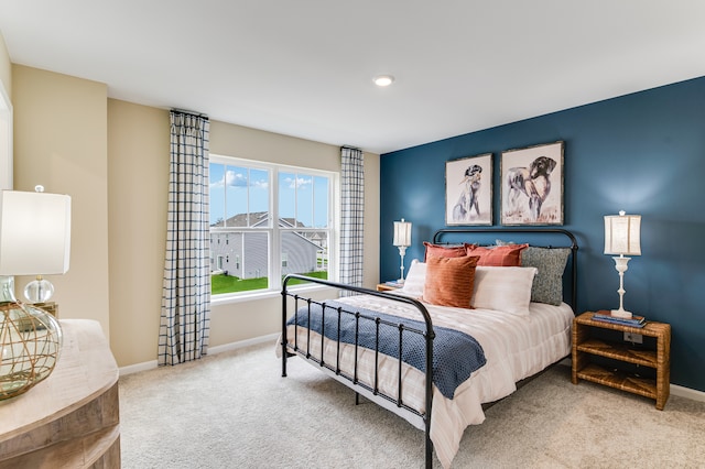 carpeted bedroom with baseboards