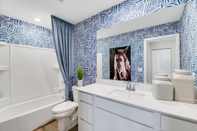full bath with wallpapered walls, wood finished floors, toilet, shower / bath combination with curtain, and vanity