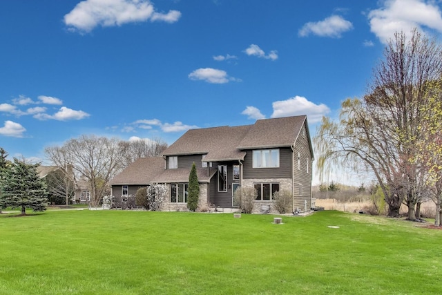 23883 W Sarah Ct, Antioch, IL 60002 - view of front of property featuring a front lawn and a shingled roof
