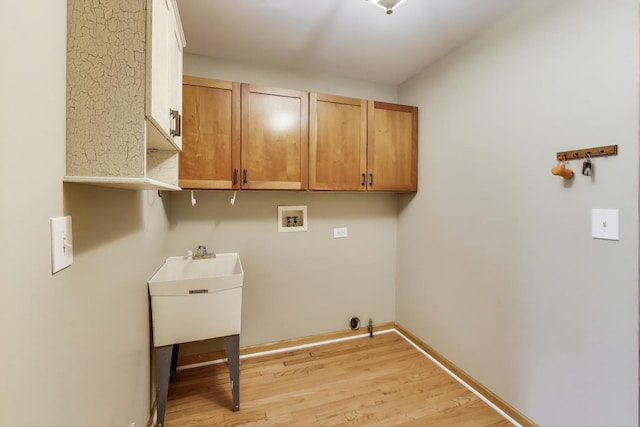 23883 W Sarah Ct, Antioch, IL 60002 - laundry area with hookup for a washing machine, light wood-style floors, cabinet space, and baseboards