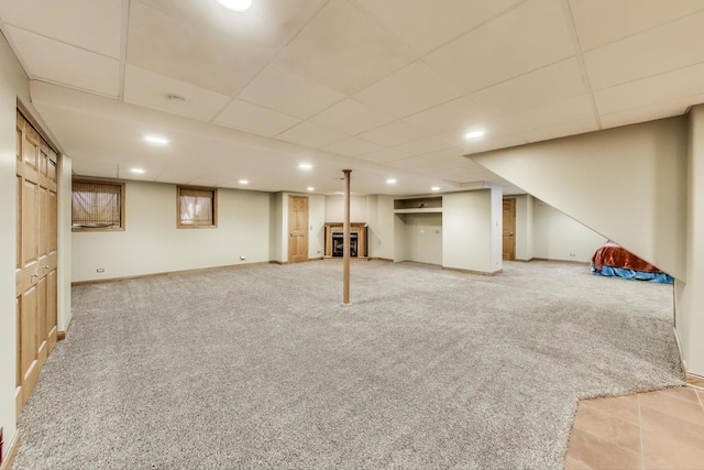 23883 W Sarah Ct, Antioch, IL 60002 - finished below grade area featuring a paneled ceiling, light colored carpet, and baseboards