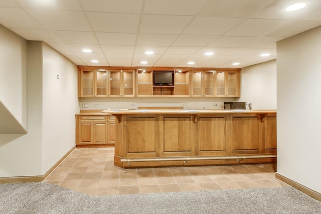 23883 W Sarah Ct, Antioch, IL 60002 - kitchen featuring light countertops, recessed lighting, baseboards, a kitchen breakfast bar, and glass insert cabinets