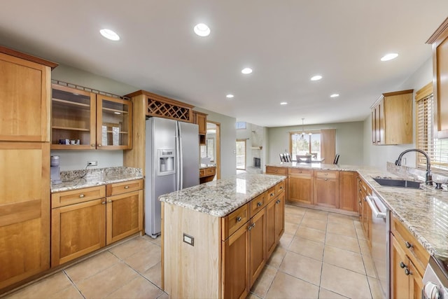 23883 W Sarah Ct, Antioch, IL 60002 - kitchen with appliances with stainless steel finishes, a sink, a peninsula, recessed lighting, and glass insert cabinets