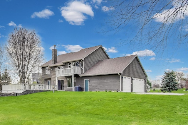 23883 W Sarah Ct, Antioch, IL 60002 - back of house with a balcony, a yard, a chimney, central AC, and roof with shingles