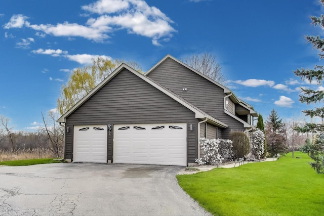 23883 W Sarah Ct, Antioch, IL 60002 - view of front of house with a front lawn, asphalt driveway, and a garage