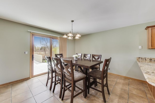 23883 W Sarah Ct, Antioch, IL 60002 - dining area with a chandelier, baseboards, and light tile patterned floors