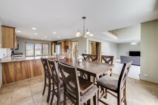23883 W Sarah Ct, Antioch, IL 60002 - dining space featuring light tile patterned floors, recessed lighting, a ceiling fan, a chandelier, and baseboards