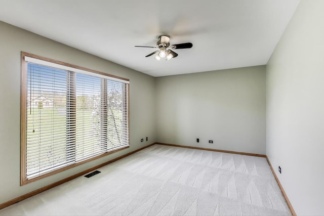 23883 W Sarah Ct, Antioch, IL 60002 - empty room with light carpet, ceiling fan, and baseboards