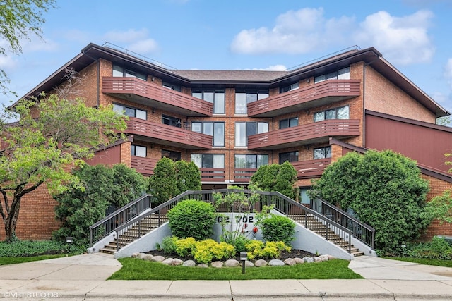 702 Waukegan Rd Unit A207, Glenview, IL 60025 - view of building exterior featuring stairway