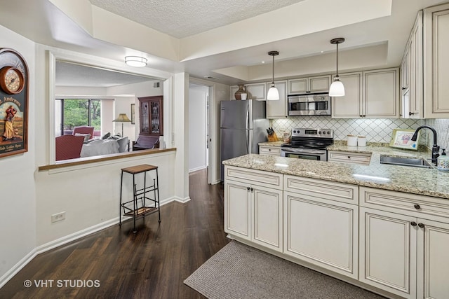 702 Waukegan Rd Unit A207, Glenview, IL 60025 - kitchen featuring appliances with stainless steel finishes, a sink, dark wood-style floors, baseboards, and tasteful backsplash