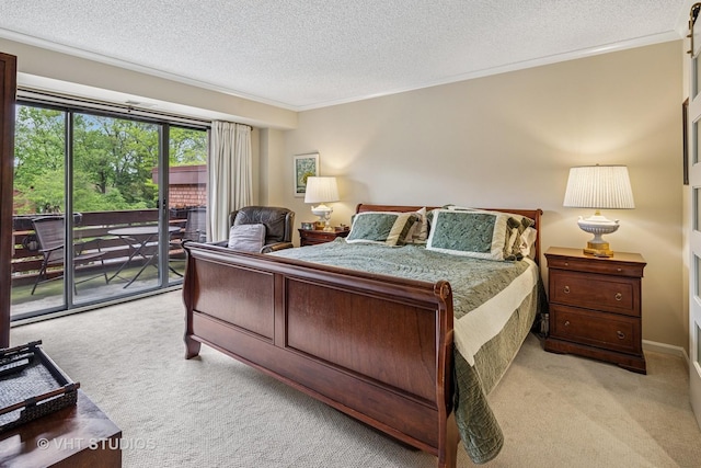 702 Waukegan Rd Unit A207, Glenview, IL 60025 - bedroom featuring light colored carpet, access to outside, a textured ceiling, and crown molding