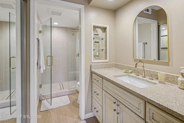 702 Waukegan Rd Unit A207, Glenview, IL 60025 - full bathroom featuring toilet, vanity, and a shower stall
