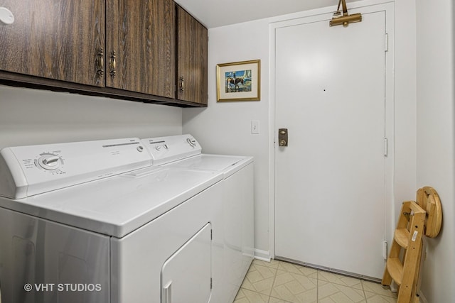 702 Waukegan Rd Unit A207, Glenview, IL 60025 - laundry area with washing machine and clothes dryer, cabinet space, and baseboards
