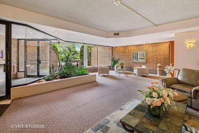 702 Waukegan Rd Unit A207, Glenview, IL 60025 - building lobby featuring a textured ceiling