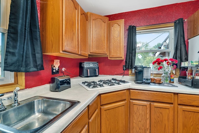 341 N Center St, Braidwood, IL 60408 - kitchen with a sink, light countertops, and white gas cooktop