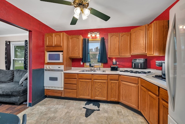 341 N Center St, Braidwood, IL 60408 - kitchen with white appliances, a sink, light countertops, ceiling fan, and plenty of natural light