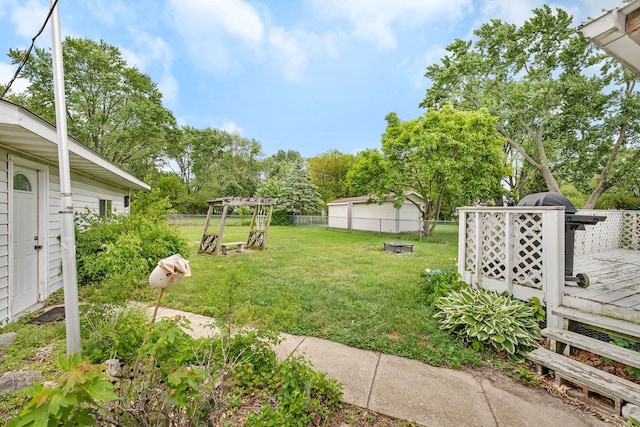 341 N Center St, Braidwood, IL 60408 - view of yard with a wooden deck and an outdoor fire pit