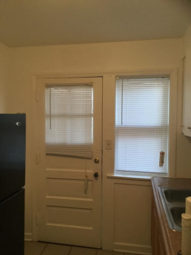 802 Bellwood Ave Unit 2S, Bellwood, IL 60104 - doorway to outside featuring a sink and tile patterned flooring