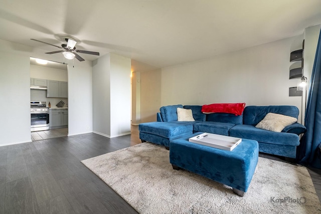 3021 S Michigan Ave Unit 102, Chicago, IL 60616 - living area with ceiling fan, dark wood-type flooring, and baseboards