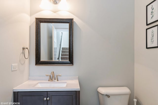bathroom with toilet and vanity