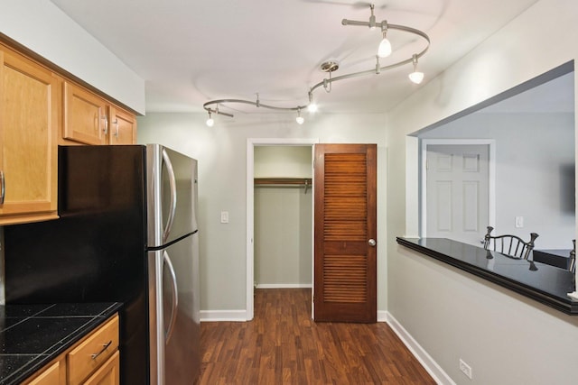 493 Mchenry Rd Unit 1B, Wheeling, IL 60090 - kitchen with dark wood finished floors, dark countertops, baseboards, and freestanding refrigerator