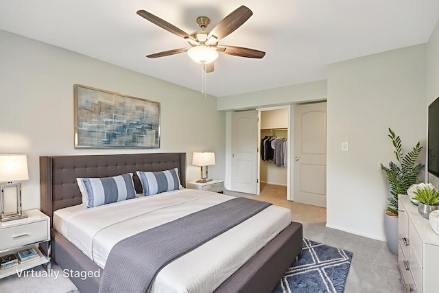 493 Mchenry Rd Unit 1B, Wheeling, IL 60090 - bedroom featuring light colored carpet, a closet, a ceiling fan, a walk in closet, and baseboards