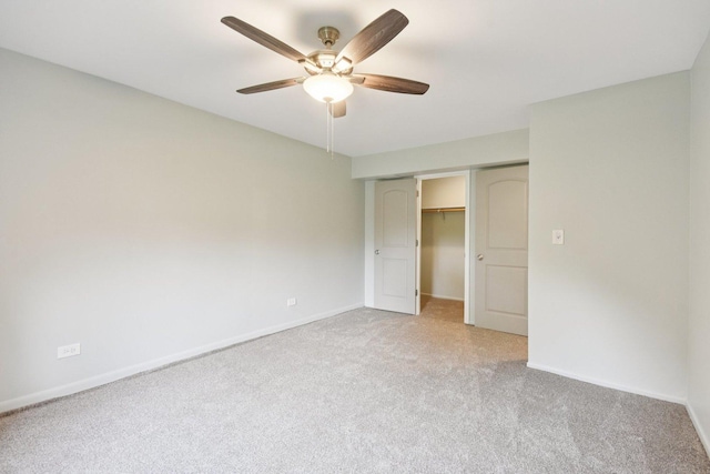 493 Mchenry Rd Unit 1B, Wheeling, IL 60090 - unfurnished bedroom featuring light colored carpet, a closet, baseboards, and a ceiling fan
