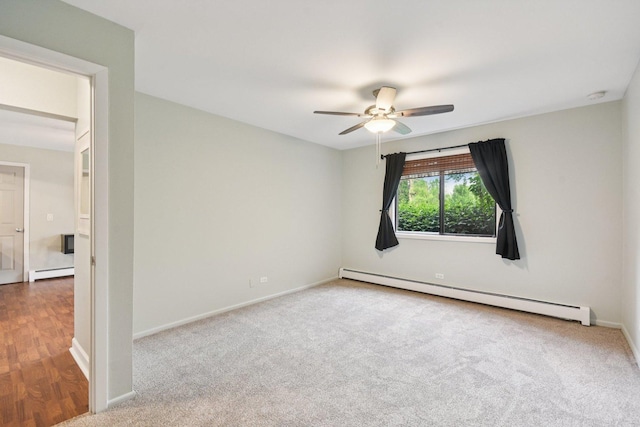 493 Mchenry Rd Unit 1B, Wheeling, IL 60090 - empty room featuring baseboard heating, a ceiling fan, baseboards, and carpet