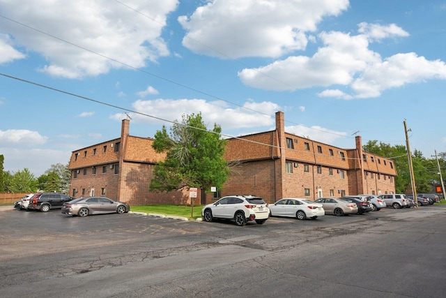 493 Mchenry Rd Unit 1B, Wheeling, IL 60090 - view of building exterior featuring uncovered parking
