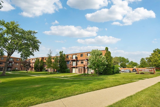 493 Mchenry Rd Unit 1B, Wheeling, IL 60090 - surrounding community with a lawn and an attached garage