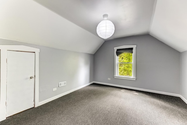 907 W 50th St, Chicago, IL 60609 - bonus room featuring vaulted ceiling, baseboards, and carpet floors