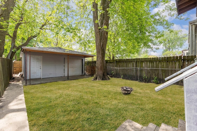 907 W 50th St, Chicago, IL 60609 - view of yard with an outdoor fire pit, an outbuilding, and a garage
