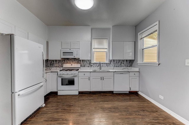 907 W 50th St, Chicago, IL 60609 - kitchen with white appliances, a sink, light countertops, and backsplash
