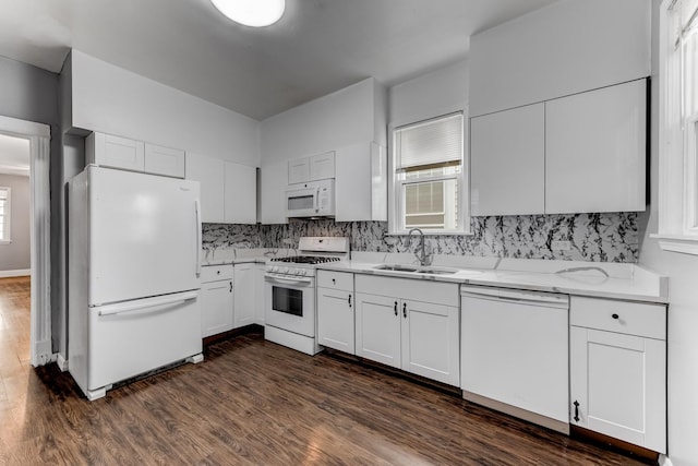 907 W 50th St, Chicago, IL 60609 - kitchen with white appliances, a sink, tasteful backsplash, dark wood-type flooring, and healthy amount of natural light