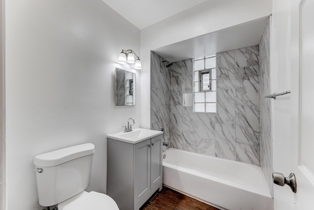 907 W 50th St, Chicago, IL 60609 - full bathroom featuring washtub / shower combination, toilet, vanity, and wood finished floors