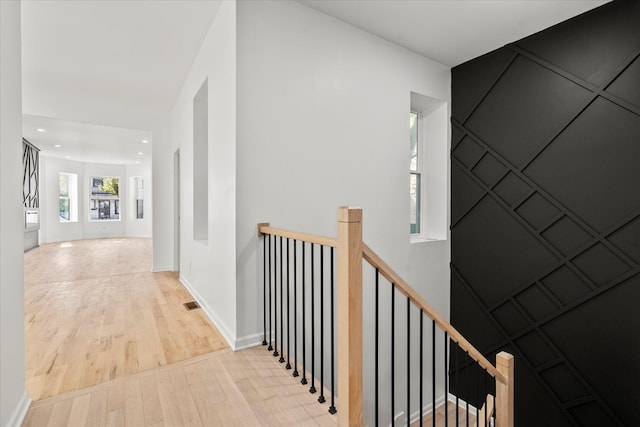 4336 W Gladys Ave, Chicago, IL 60624 - corridor featuring wood finished floors, an upstairs landing, baseboards, and recessed lighting