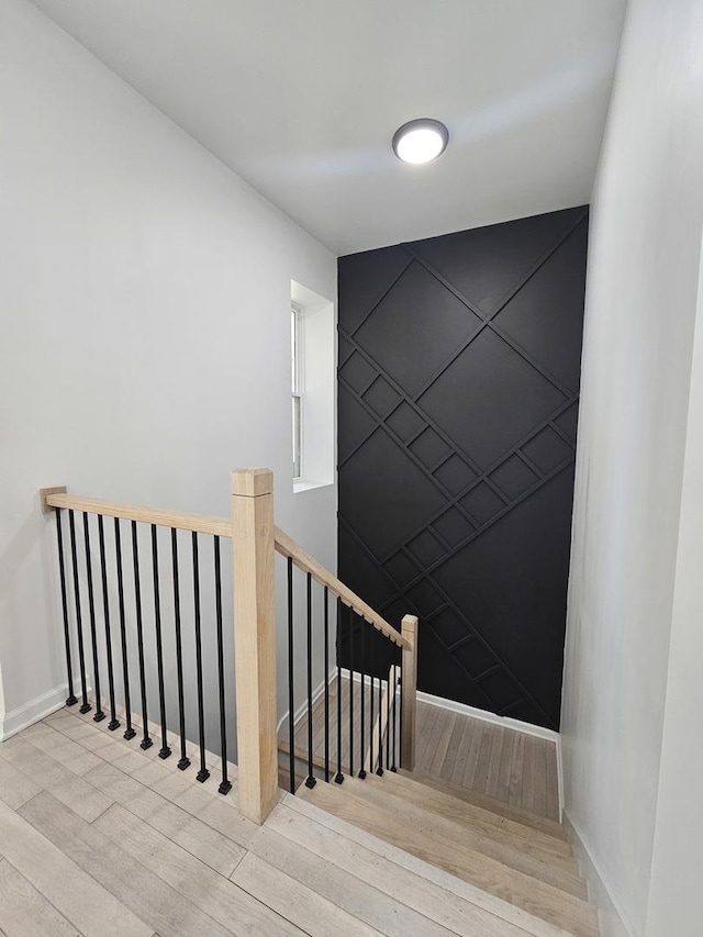 4336 W Gladys Ave, Chicago, IL 60624 - staircase with wood finished floors and baseboards