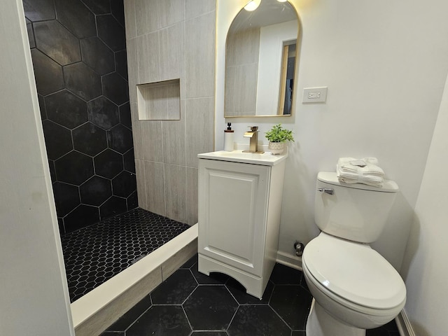 4336 W Gladys Ave, Chicago, IL 60624 - bathroom with toilet, vanity, tile patterned flooring, and a stall shower