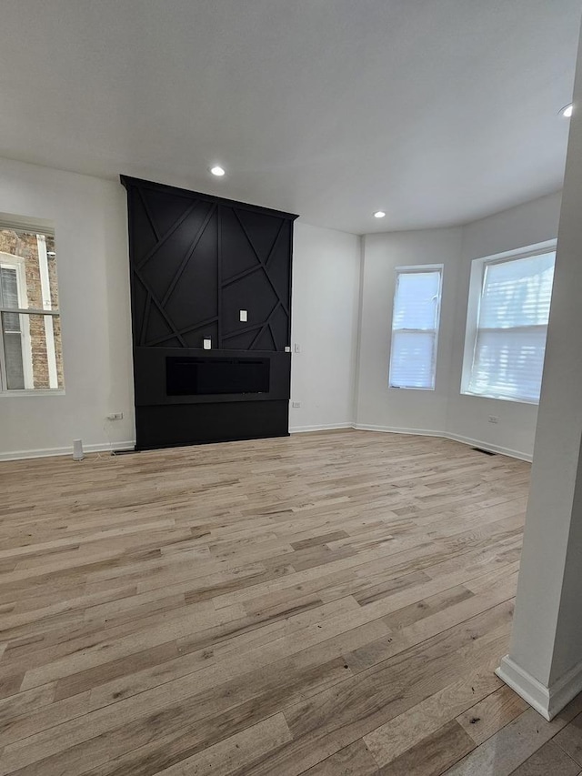 4336 W Gladys Ave, Chicago, IL 60624 - unfurnished living room with wood finished floors, baseboards, and recessed lighting